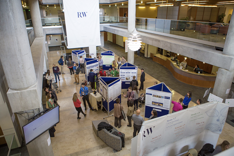 A view from the library balcony of a Research Week poster session in action (photo: USU Office of Research)